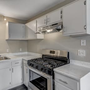 the preserve at ballantyne commons apartment kitchen with stove and sink at Desert Bay Apartments, Laughlin