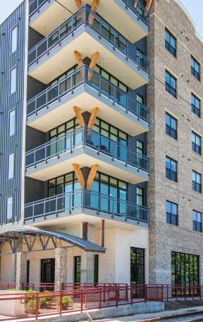 a large apartment building with balconies and a large sign on the side of it