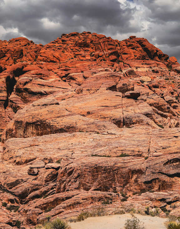 A rocky landscape with a cloudy sky above.