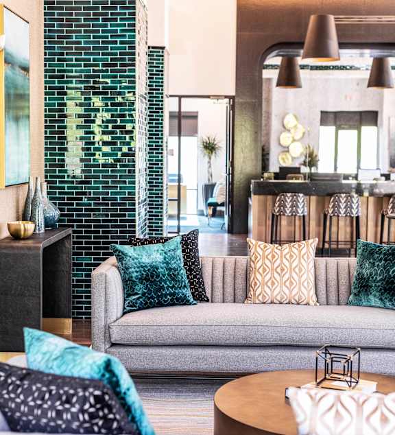 A living room with a grey couch and a coffee table.