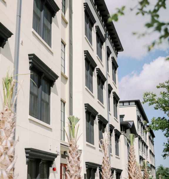 a row of apartment buildings on a city street