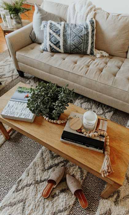 a living room filled with furniture and a rug