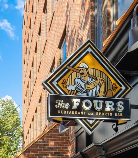 A sign for The Fours Restaurant and Sports Bar.