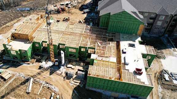A construction site with a large building under construction.