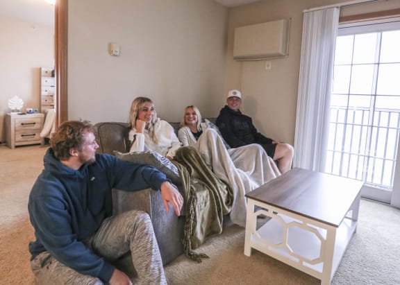 people sitting on a couch in a living room at Boulder Ridge, Minnesota