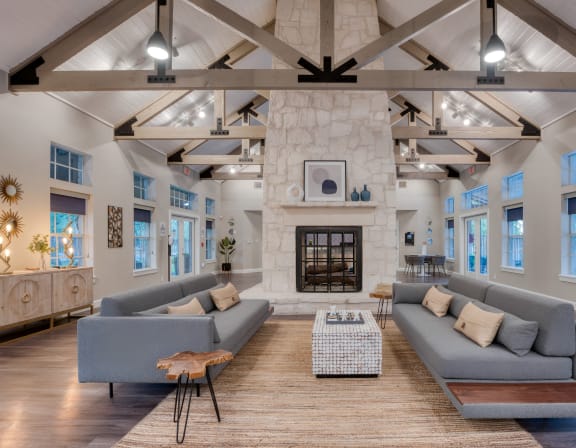 a living room with couches and a fireplace