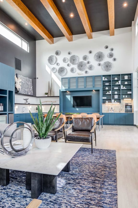 a lobby with a desk chairs and a couch