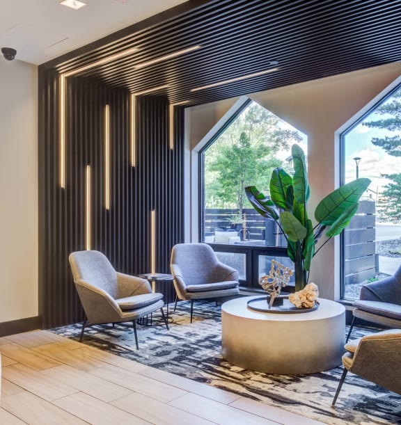 a lobby with a bench and pillows on it