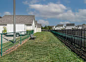 Thumbnail 3 of 5 - a fenced in yard with a bench next to a fence