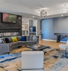 a living room with blue walls and a couch and a coffee table
