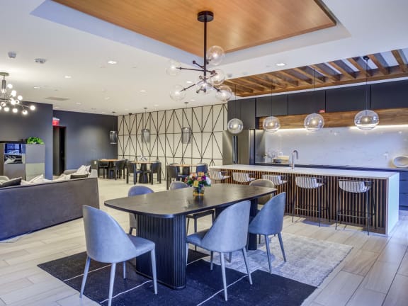 a dining room with a table and chairs in a lobby