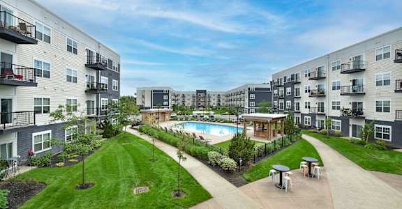 A black background with the words "BAY BREEZE Luxury Waterfront Living" and a button that says "Schedule a Tour".