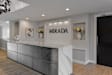 a reception area with a marble counter top and a sign that reads mirada