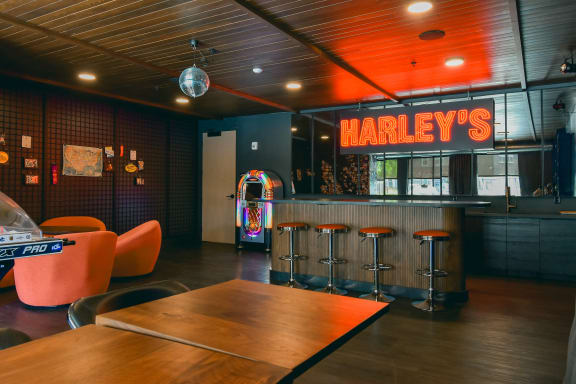 a restaurant with a table and a bar with a jukebox