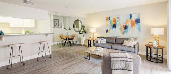 a living room with a gray couch and a gray coffee table