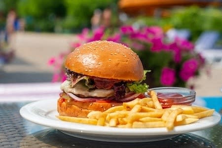 a sandwich and fries on a plate on a table