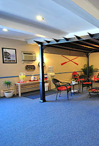 a room with a table and chairs and a bar