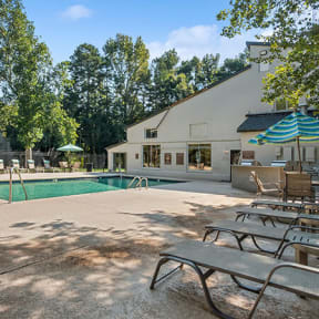 Community Swimming Pool with Pool Furniture at Stoney Trace Apartments in Charlotte, NC-SMLAM.