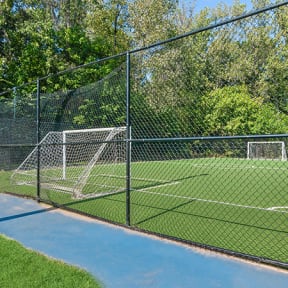 Community Soccer Field with Nets and Walking Track at Stoney Trace Apartments in Charlotte, NC-SMLAM.