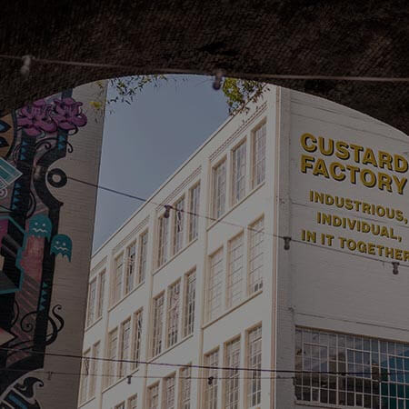 a large white building with a sign on the side of it