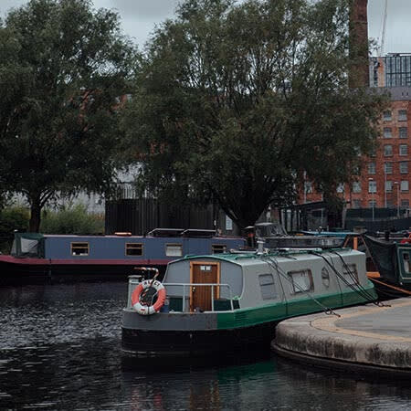 a group of boats are docked in the water
