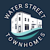 A logo for Water Street Townhomes features a white house on a blue wave.