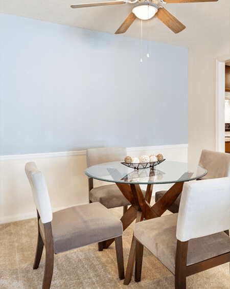 a kitchen with gray cabinets and granite countertops