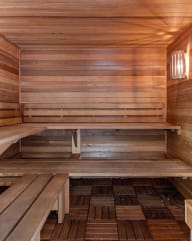 a sauna with wooden benches and a window