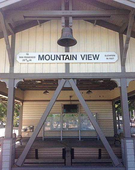 A signboard with a bell on it that says Mountain View.