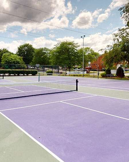apartment complex with tennis court