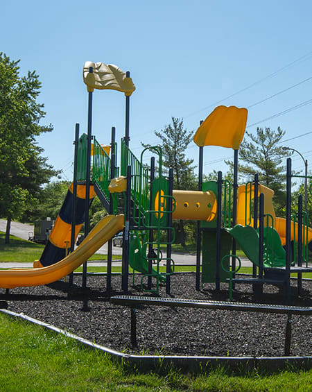 playground with slides at eastland apartments in Grand Rapids