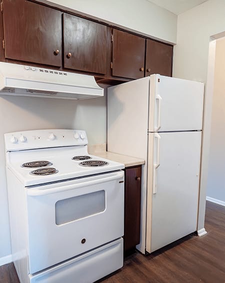 a kitchen with gray cabinets and granite countertops