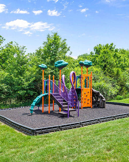 a childrens playground with a slide and other toys