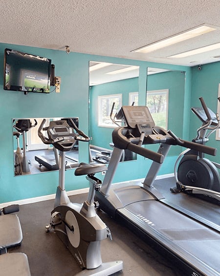 fitness center at apartment community