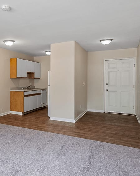 a kitchen and living room in a 555 waverly unit