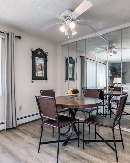 a kitchen with gray cabinets and granite countertops