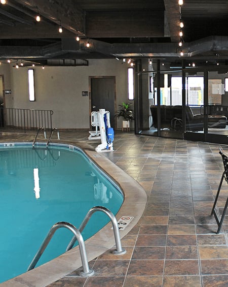 a view of the indoor pool and hot tub in the holiday inn express & suites