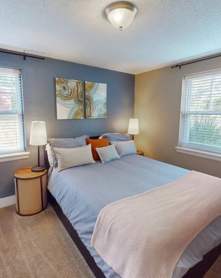 apartment bedroom with big windows