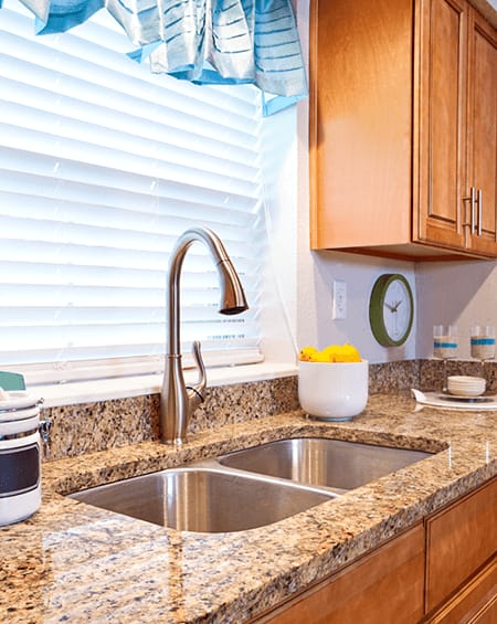apartment kitchen with granite countertops