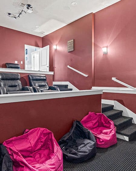 a waiting room with bags on the floor