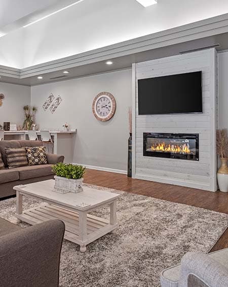 a living room filled with furniture and a fire place