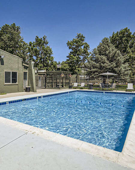 a swimming pool with a fence around it