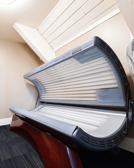 an open suitcase sitting on top of a chair in a room
