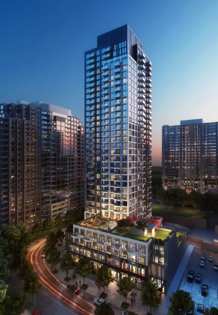 an aerial view of a tall skyscraper in front of a city skyline