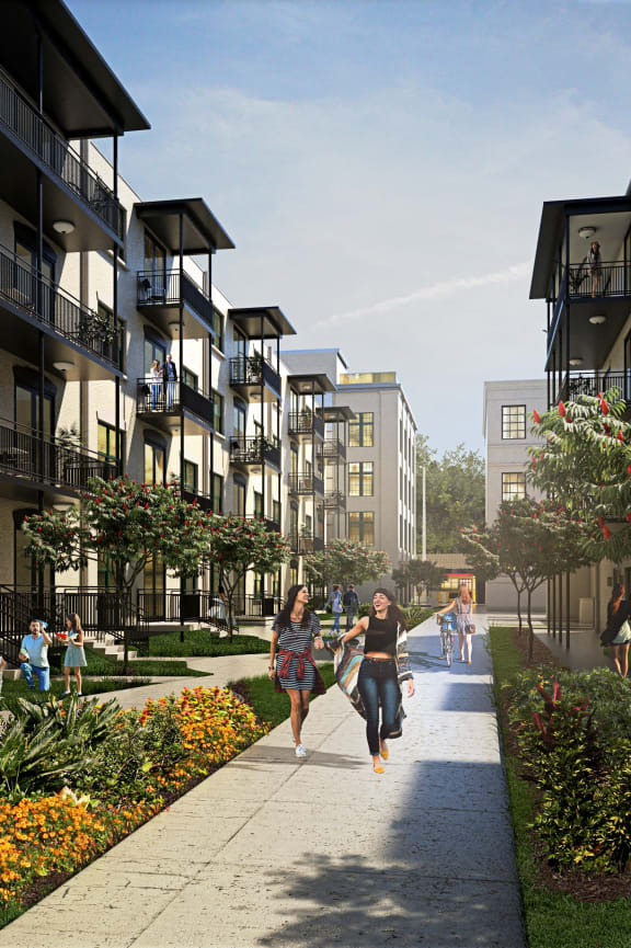 a rendering of people walking on a sidewalk in front of apartment buildings at Casa Marti, Tampa, FL
