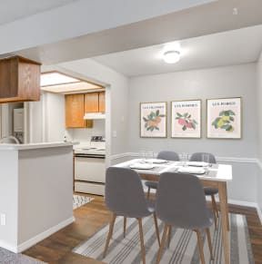 a dining room with a table and chairs and a kitchen