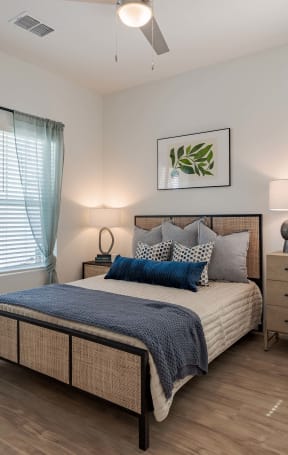 a bedroom with a bed and a dresser