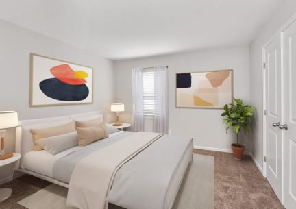 a bedroom with a bed and two paintings on the wall