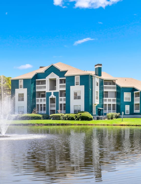 Large Pond & Fountain With Apartment Homes Overlooking