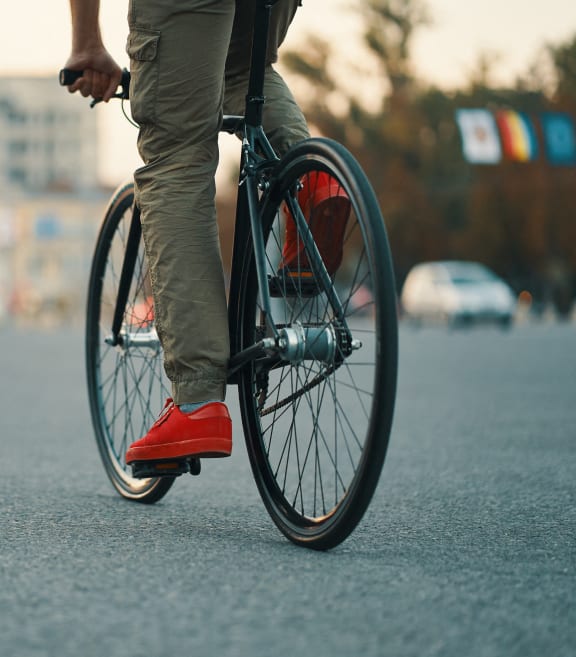 a man riding a bike on the street at Link Apartments® CYKEL Apartments, Charlotte , NC
